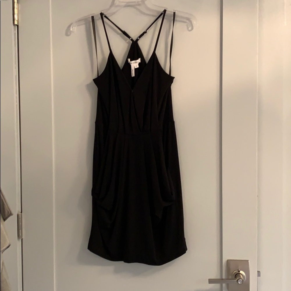 Black mini dress with pockets.